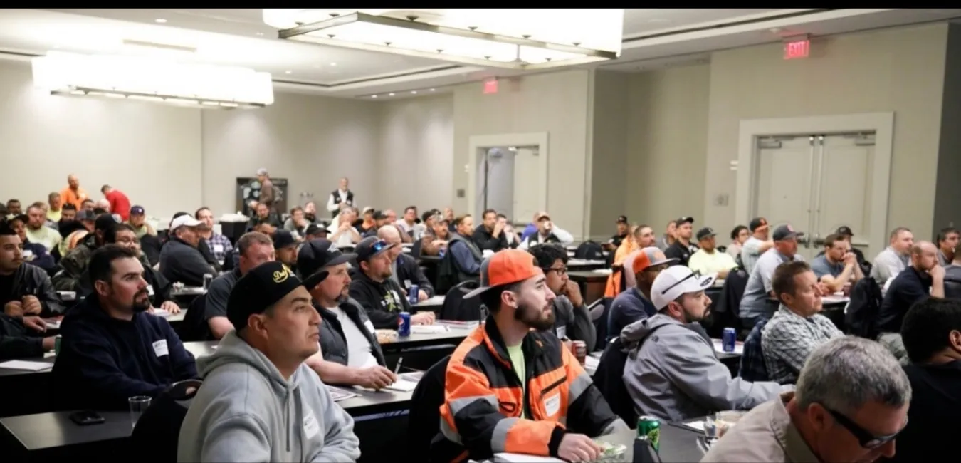 Packed room of field leaders listening to Mark Breslin
