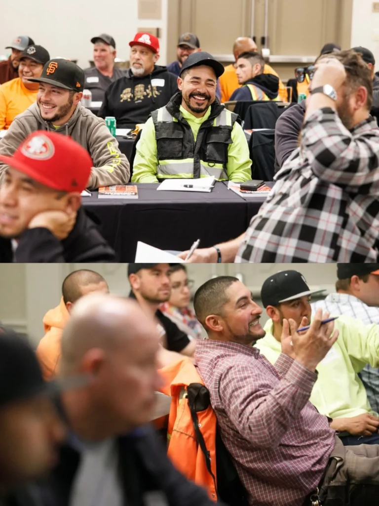 Field leaders laughing and engaged during a Five Minute Foreman workshop