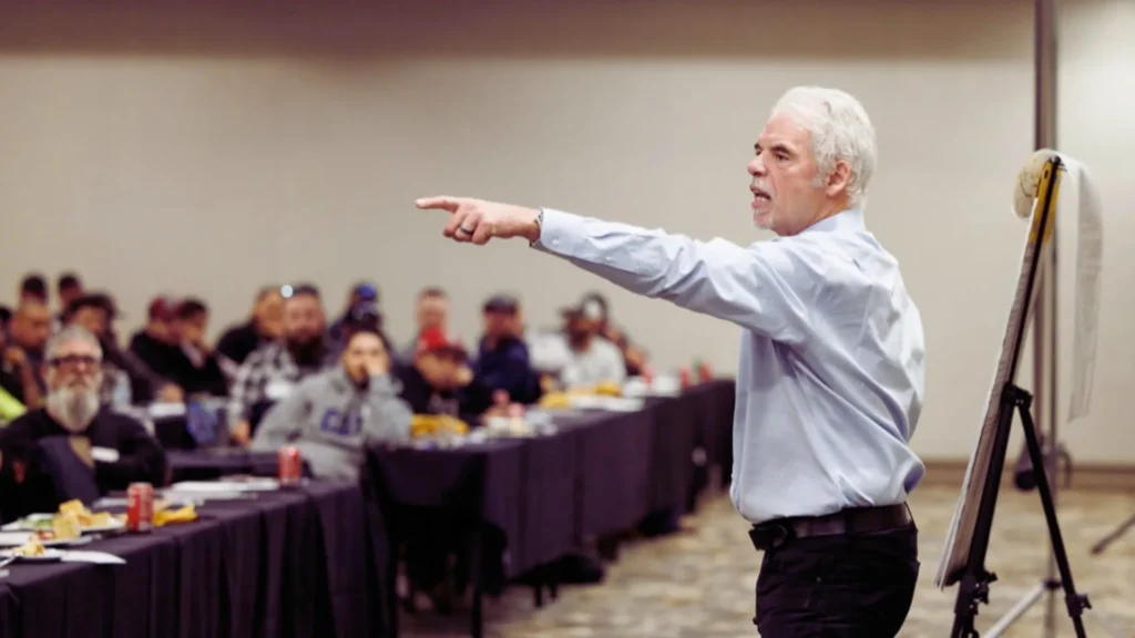 Mark Breslin presenting to a full room